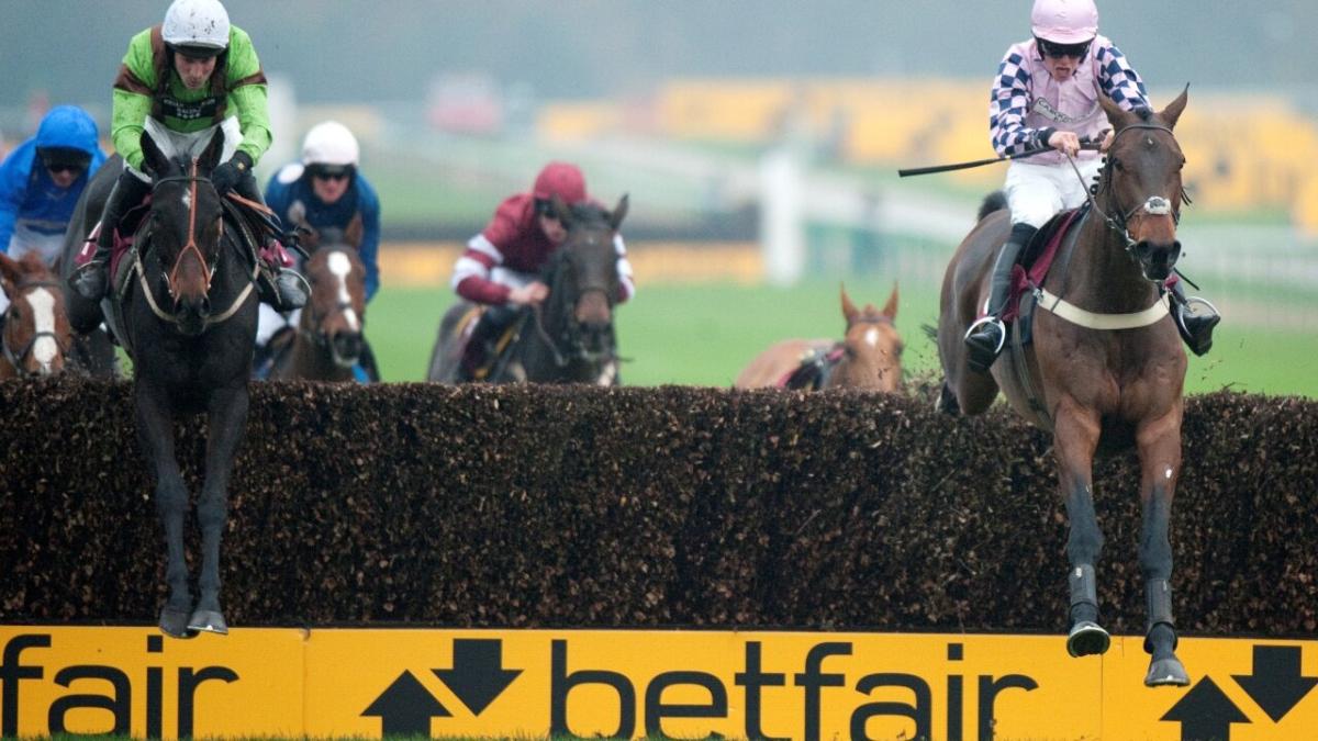 Horses jumping at Haydock Racecourse